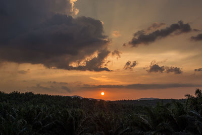 Scenic view of landscape against sky during sunset