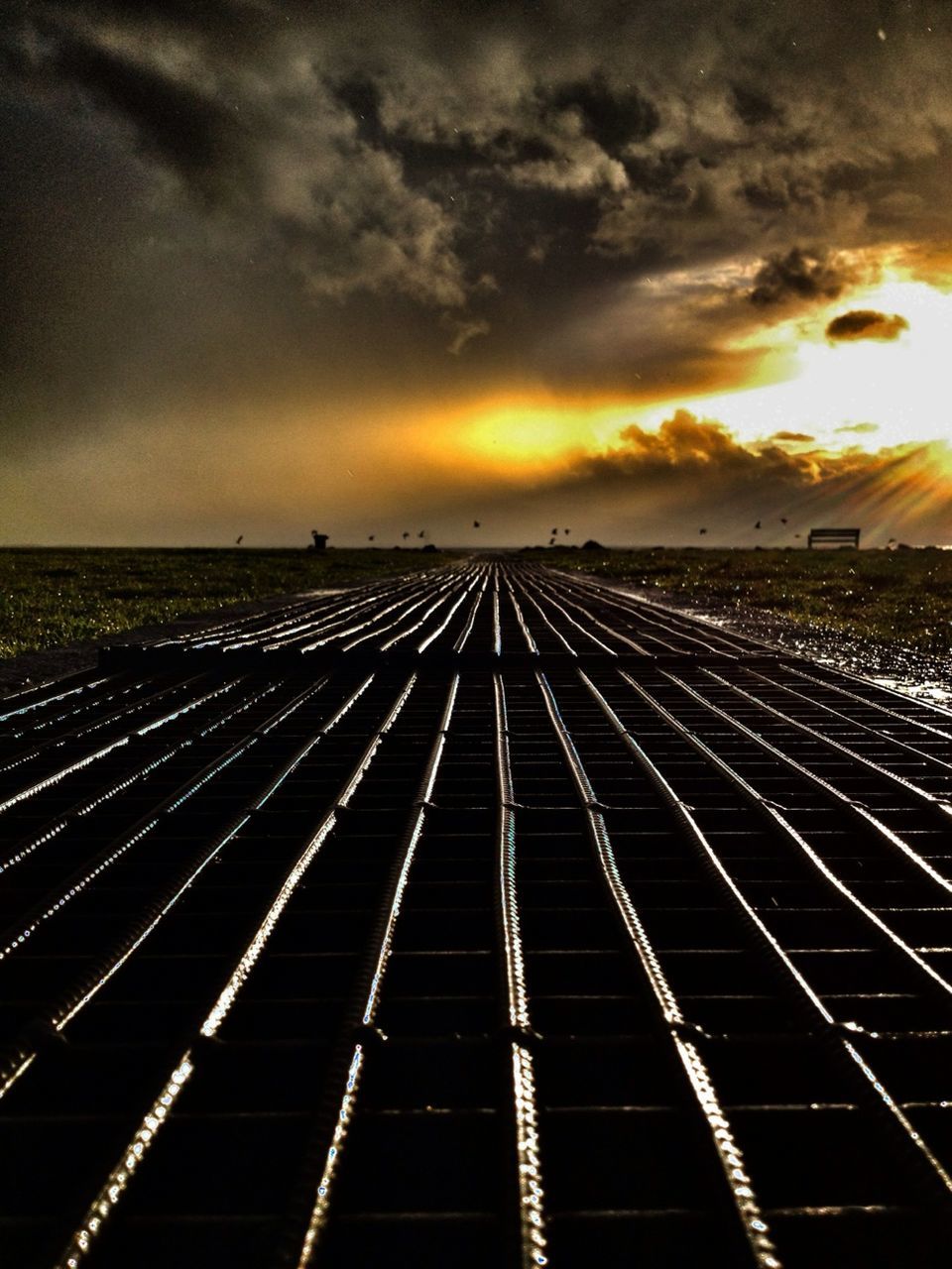 sunset, sky, cloud - sky, orange color, cloudy, dramatic sky, cloud, transportation, the way forward, diminishing perspective, weather, built structure, scenics, dusk, outdoors, beauty in nature, nature, no people, architecture, vanishing point