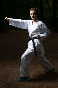 Portrait of young man standing on land