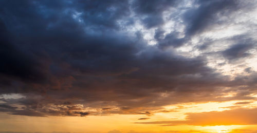 Low angle view of cloudy sky during sunset