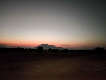 Scenic view of silhouette landscape against sky during sunset