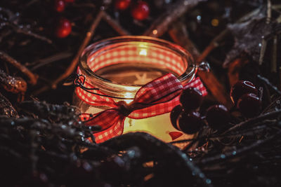 Close-up of candles with christmas decorations