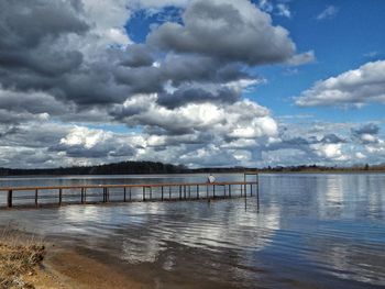 Pier over sea against sky