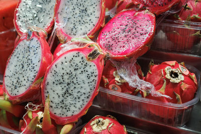 Pitaya or pitahaya or red dragon fruit on the counter for sale.