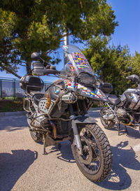 Motorcycle parked on roadside against sky