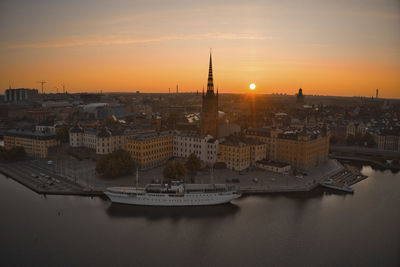 High angle view of buildings in city during sunset