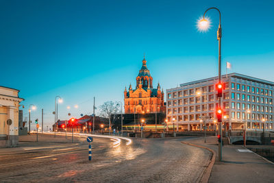 Low angle view of buildings in city at night