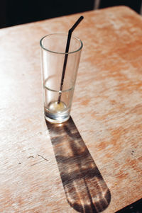 Close-up of beer glass on cutting board