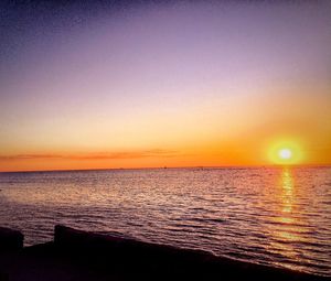 Scenic view of sea at sunset