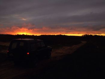 Scenic view of landscape against dramatic sky