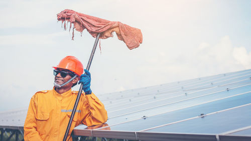 Manual worker cleaning solar panels