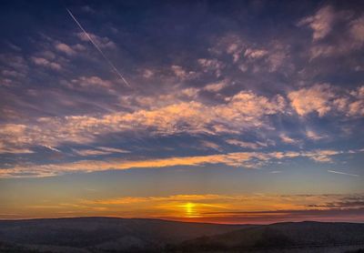 Scenic view of dramatic sky during sunset