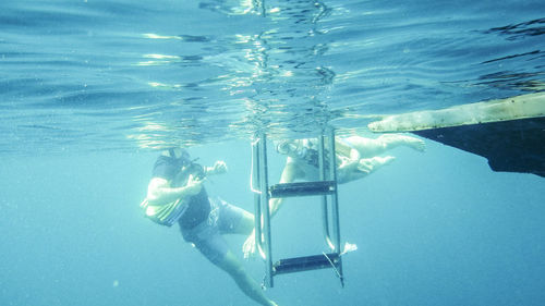 Woman swimming in pool