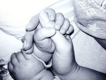 Close-up of hands holding baby