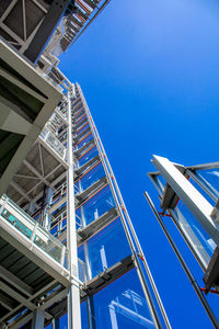 Low angle view of modern building against clear blue sky