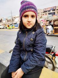 Winter season  cute girl  pakistani shining eyes beautiful  inocent  lovely  smiling face  sitting 