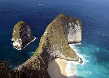 High angle view of rock formation bay in sea