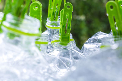 Close-up of water drops on glass against white background