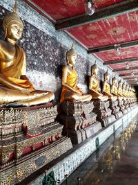 Statues in temple outside building