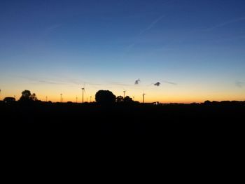 Silhouette of landscape against sky at sunset