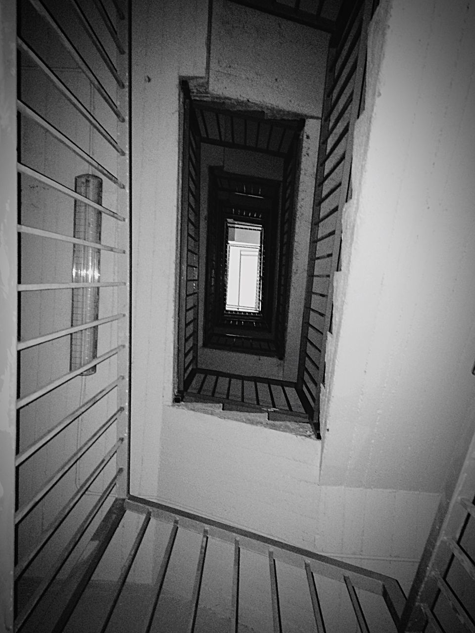 STAIRCASE SEEN THROUGH WINDOW