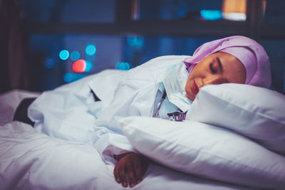 Woman sleeping on bed
