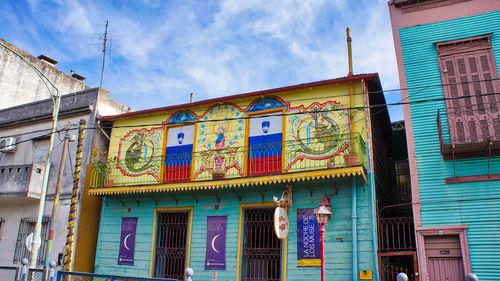 Low angle view of multi colored building against sky