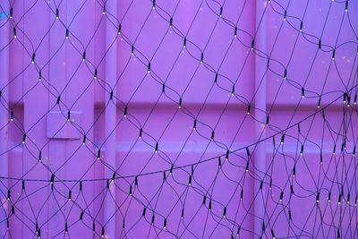 Full frame shot of chainlink fence against sky