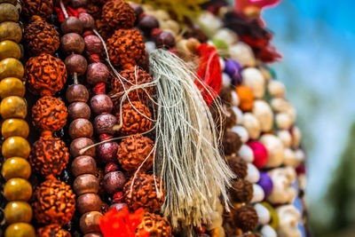 Close-up of multi colored jewelry for sale in market