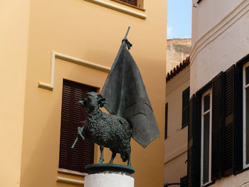 Low angle view of statue on house