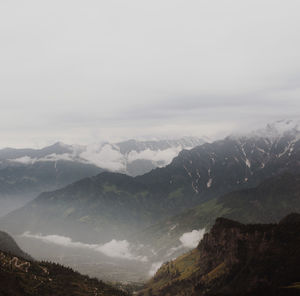 Scenic view of mountains against sky during winter