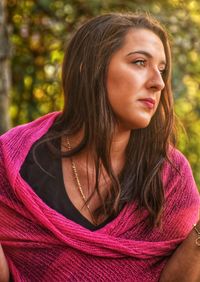 Portrait of beautiful young woman looking away