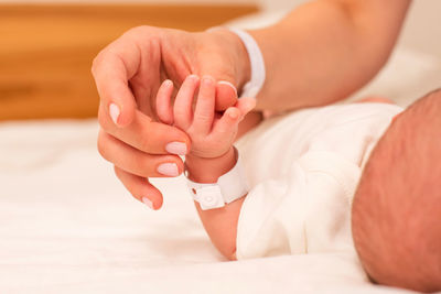 Cropped hand of doctor examining patient