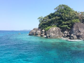 Scenic view of sea against clear blue sky