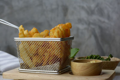 Close-up of bread in basket on table