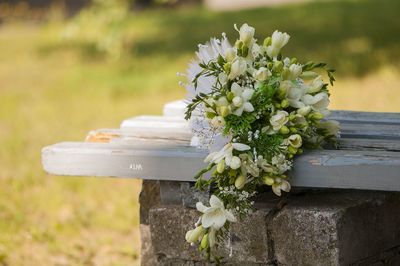 Flowers bouquet on bench during wedding