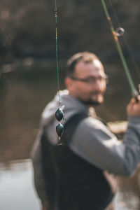 Close-up of young woman fishing