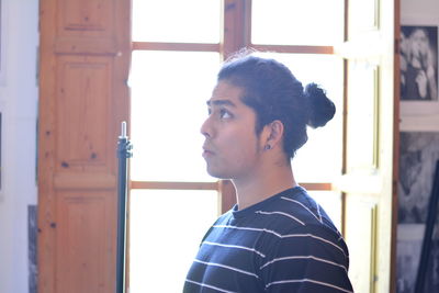 Portrait of young man looking away