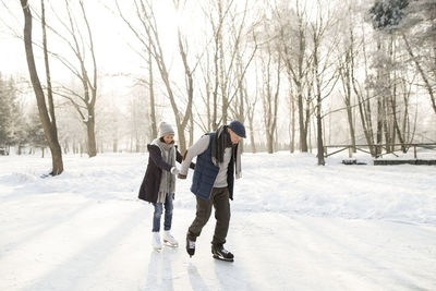 Senior couple ice skating