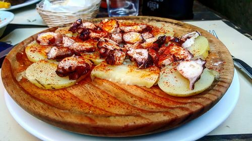 High angle view of pizza in plate on table