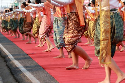 Low section of people dancing outdoors