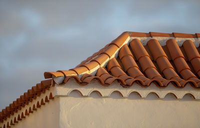 Low angle view of roof against sky