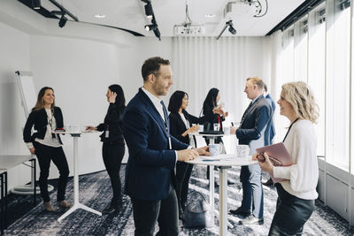 Business professionals discussing at workplace