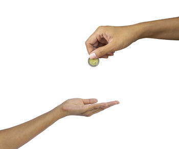 Close-up of woman hand against white background