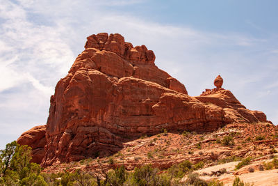 Low angle view of rock formation against sky