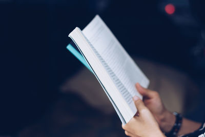 Close-up of hand holding book