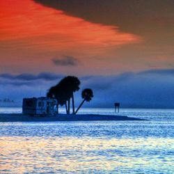 Scenic view of sea at sunset