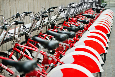 Red bicycles in row at parking lot