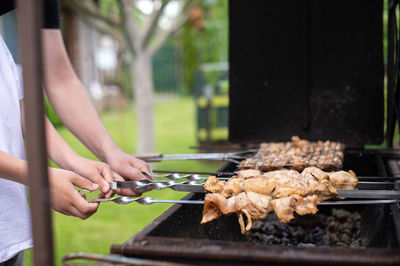 Cropped hand of person preparing food