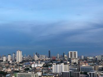 Modern buildings in city against sky